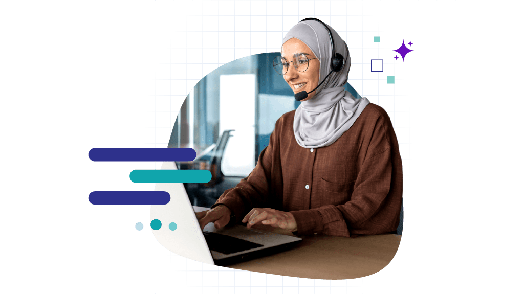 Woman with a headset speaking while looking at a laptop